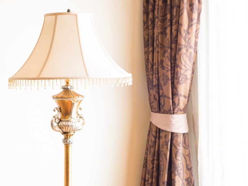 Pillow on sofa with light lamp decoration of living room interior
